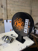 LETRERO REDONDO DOBLE CARA CON ILUMINACIÓN